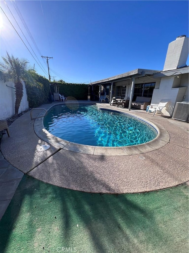 view of pool with a patio area and a fenced in pool