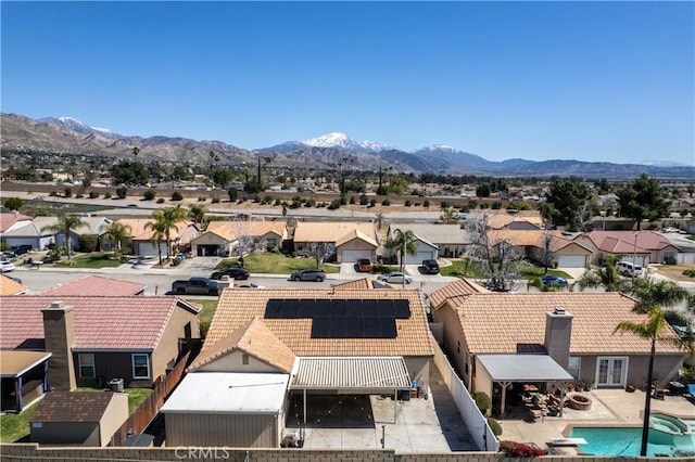 birds eye view of property featuring a mountain view and a residential view