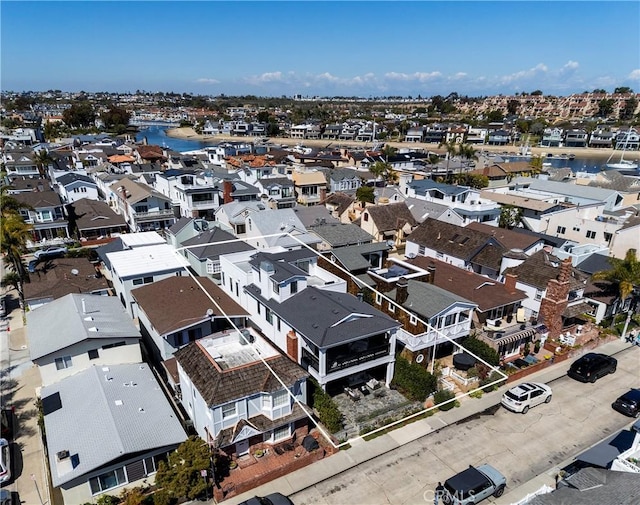 birds eye view of property featuring a residential view and a water view