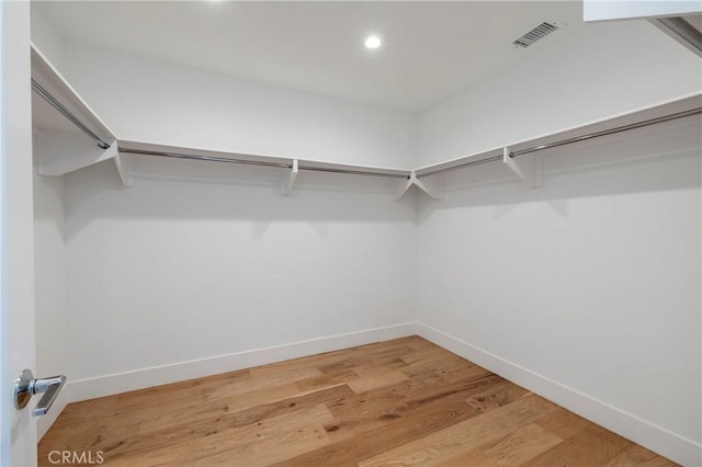 walk in closet featuring visible vents and light wood-style floors