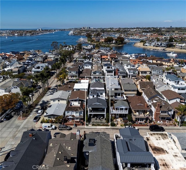 bird's eye view with a residential view and a water view