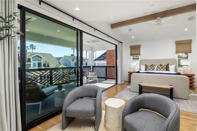 bedroom featuring recessed lighting, beam ceiling, wood finished floors, and access to outside