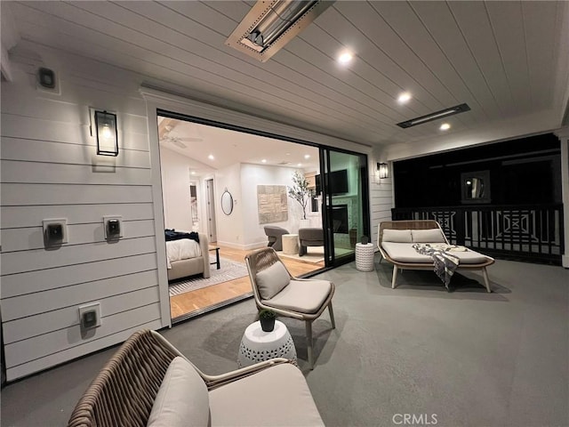 home theater room featuring recessed lighting, wood ceiling, and a fireplace