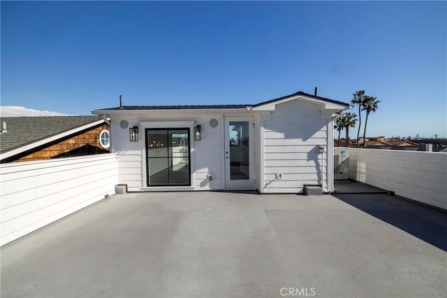 exterior space with fence and a patio area