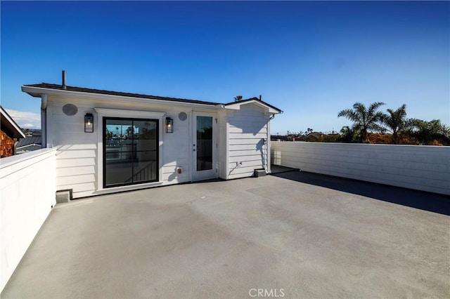 exterior space featuring a patio area and fence