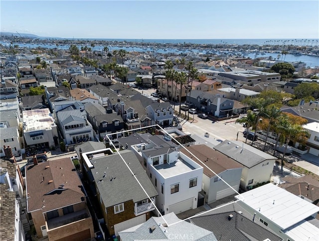 aerial view featuring a residential view and a water view