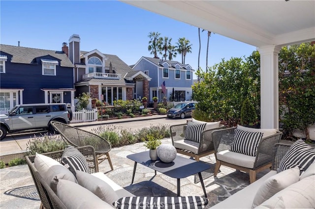 view of patio with an outdoor living space and a residential view