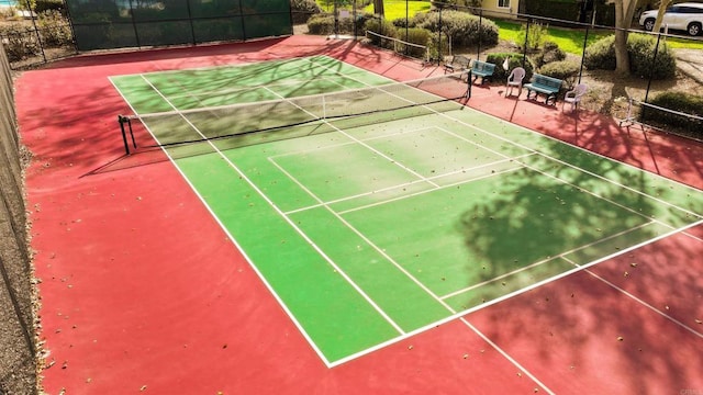 view of tennis court with fence