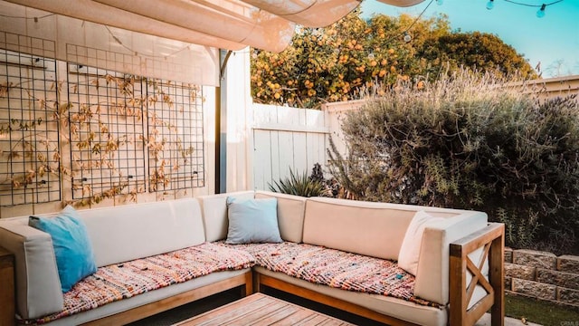 view of patio / terrace featuring fence and an outdoor hangout area