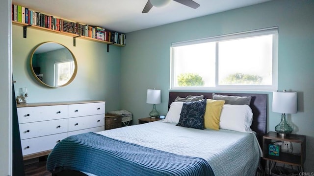 bedroom featuring wood finished floors and a ceiling fan