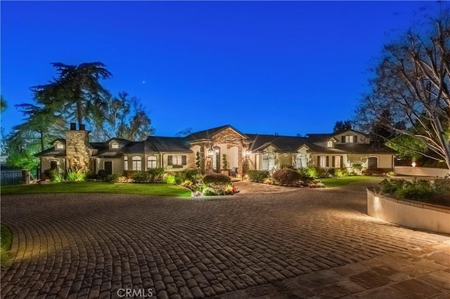 view of front of house featuring decorative driveway