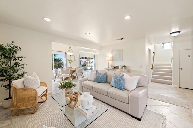 living area with recessed lighting, visible vents, stairs, and light tile patterned floors