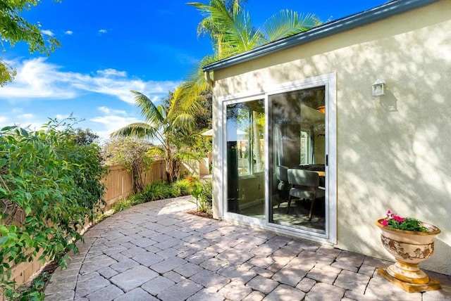 view of patio featuring fence