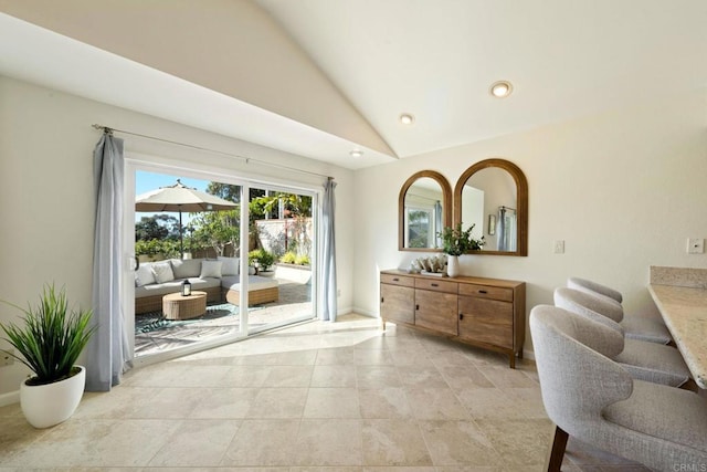 sitting room featuring light tile patterned flooring, recessed lighting, baseboards, and lofted ceiling