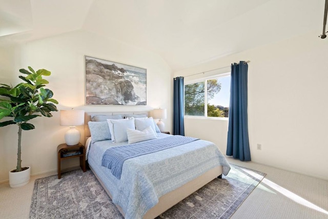 bedroom featuring carpet flooring and vaulted ceiling