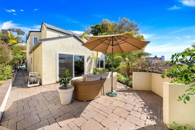 view of patio / terrace featuring fence