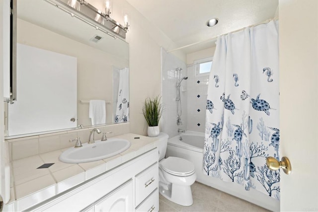 bathroom featuring tile patterned floors, visible vents, shower / tub combo with curtain, toilet, and vanity