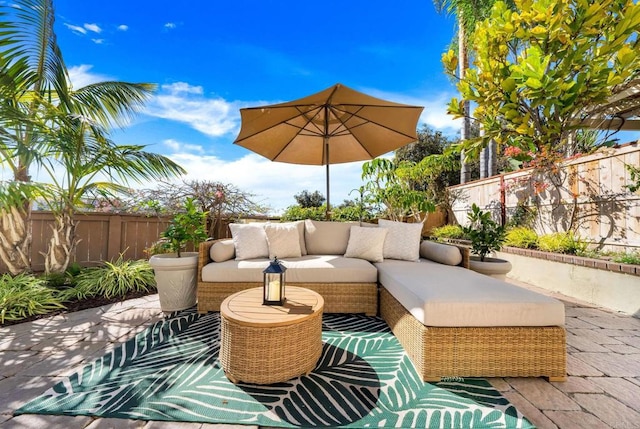 view of patio featuring a fenced backyard and an outdoor hangout area