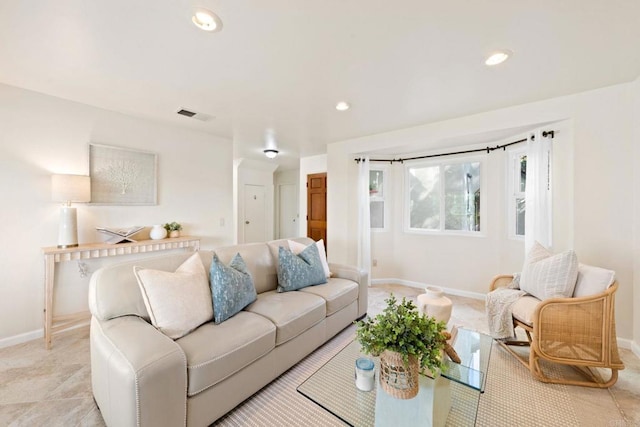 living room with recessed lighting, visible vents, and baseboards