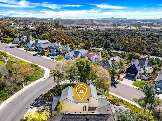 bird's eye view featuring a mountain view and a residential view