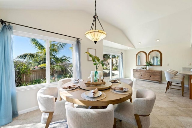 dining area with lofted ceiling, recessed lighting, and baseboards