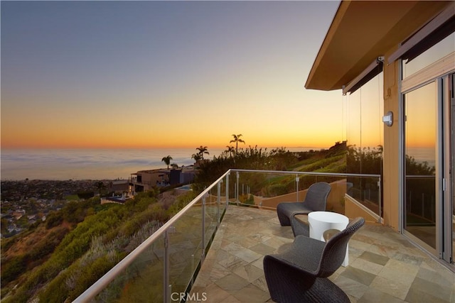 view of balcony at dusk