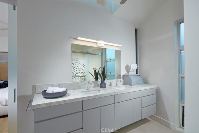 bathroom with double vanity, tile patterned floors, ensuite bath, and a sink