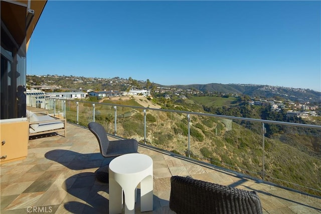 balcony featuring a mountain view