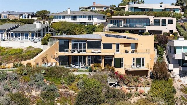 1415 Coral Dr, Laguna Beach, CA 92651 - rear view of house with stucco siding and a residential view