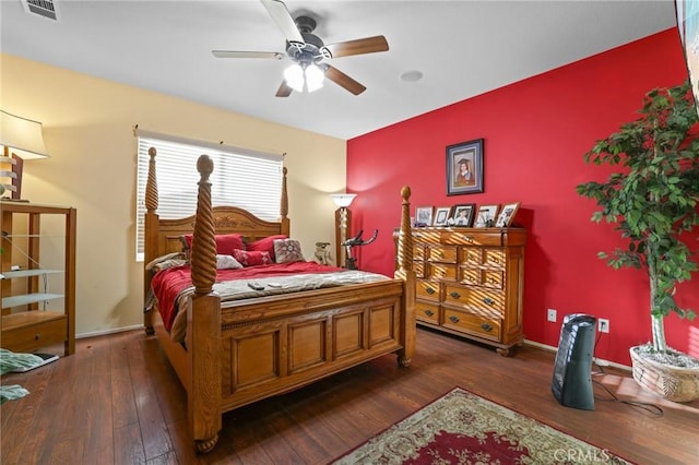 bedroom with visible vents, baseboards, dark wood-type flooring, and ceiling fan