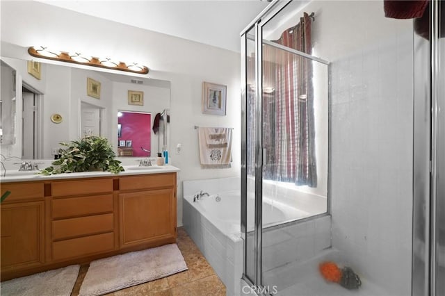 full bath featuring a shower stall, a bath, double vanity, and a sink