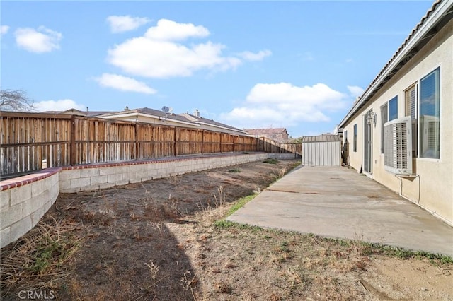 view of yard with a patio and a fenced backyard