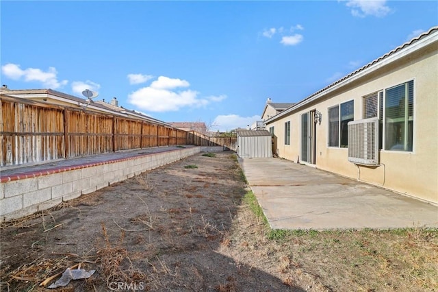 view of yard featuring a patio and a fenced backyard