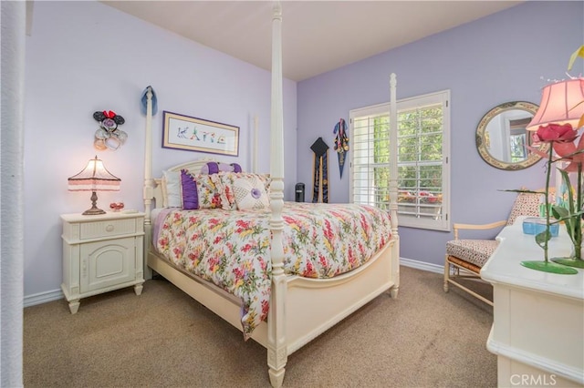 bedroom with carpet flooring and baseboards