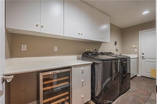 washroom with independent washer and dryer, beverage cooler, and cabinet space