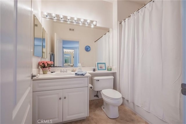 full bath featuring toilet, tile patterned floors, and vanity