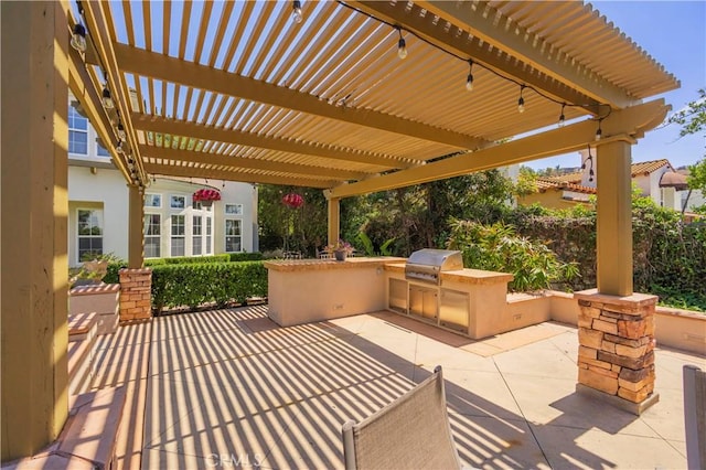 view of patio featuring grilling area, an outdoor kitchen, and a pergola