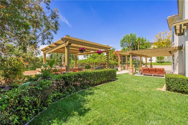 view of yard with a pergola and a patio area