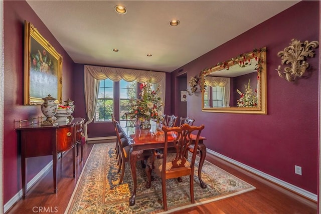 dining room with recessed lighting, baseboards, and wood finished floors