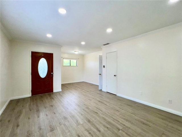 entrance foyer featuring wood finished floors, visible vents, baseboards, recessed lighting, and crown molding