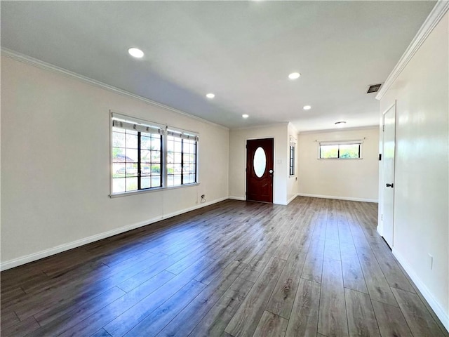 foyer with recessed lighting, baseboards, dark wood-type flooring, and ornamental molding