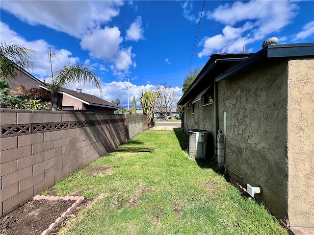 view of yard with a fenced backyard