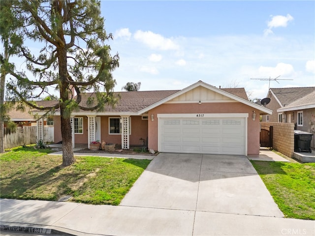 ranch-style home with stucco siding, driveway, an attached garage, and fence