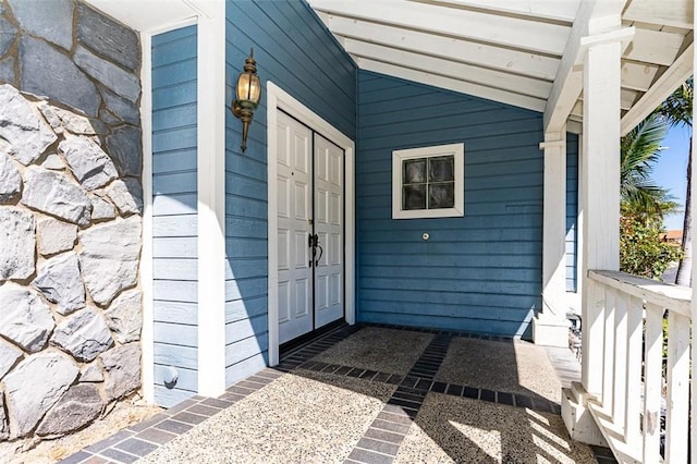 doorway to property with a porch