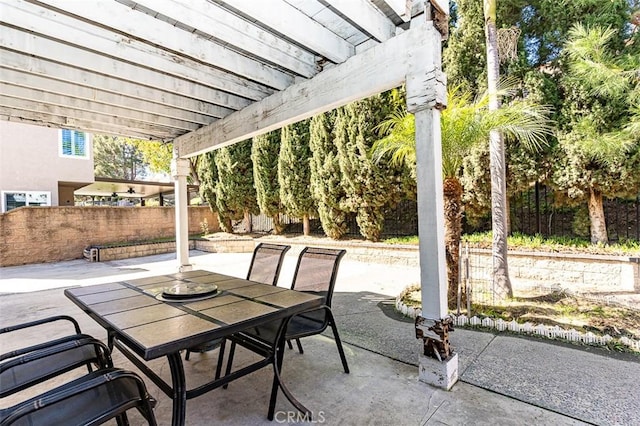 view of patio / terrace with outdoor dining area, a pergola, and fence