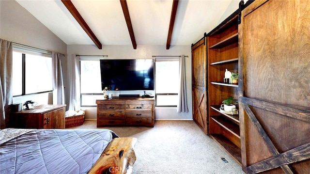 bedroom with a barn door, lofted ceiling with beams, carpet, and baseboards