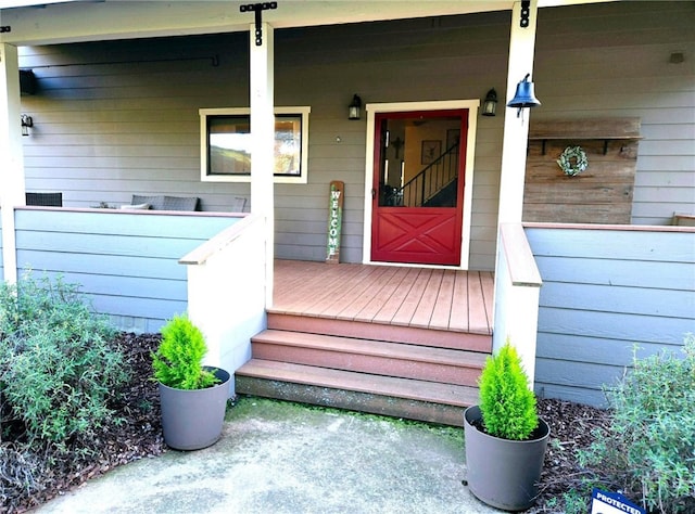 view of exterior entry featuring a porch