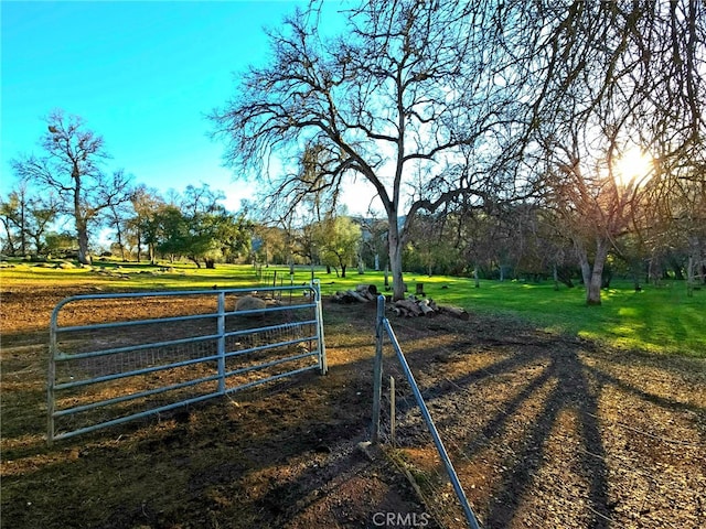 exterior space featuring a gate and a rural view