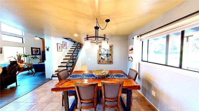 dining room with stairs and visible vents