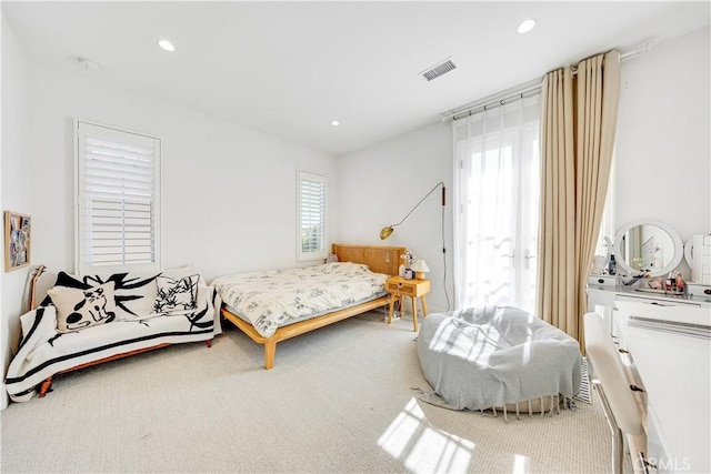 bedroom with recessed lighting, carpet, and visible vents